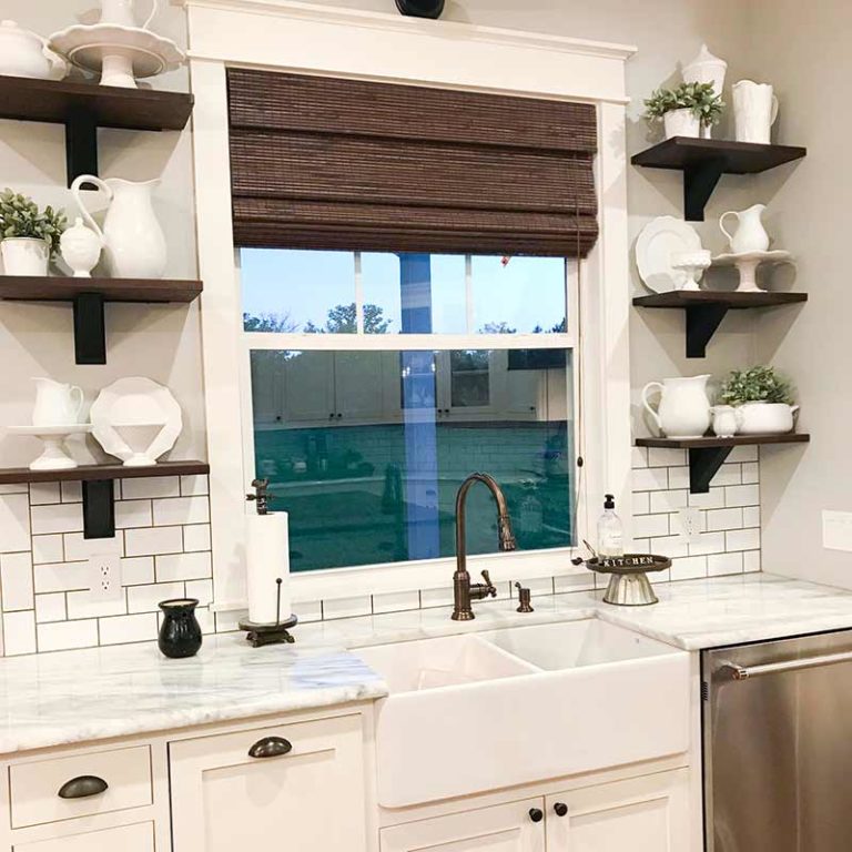 Farmhouse kitchen sink with shelves.