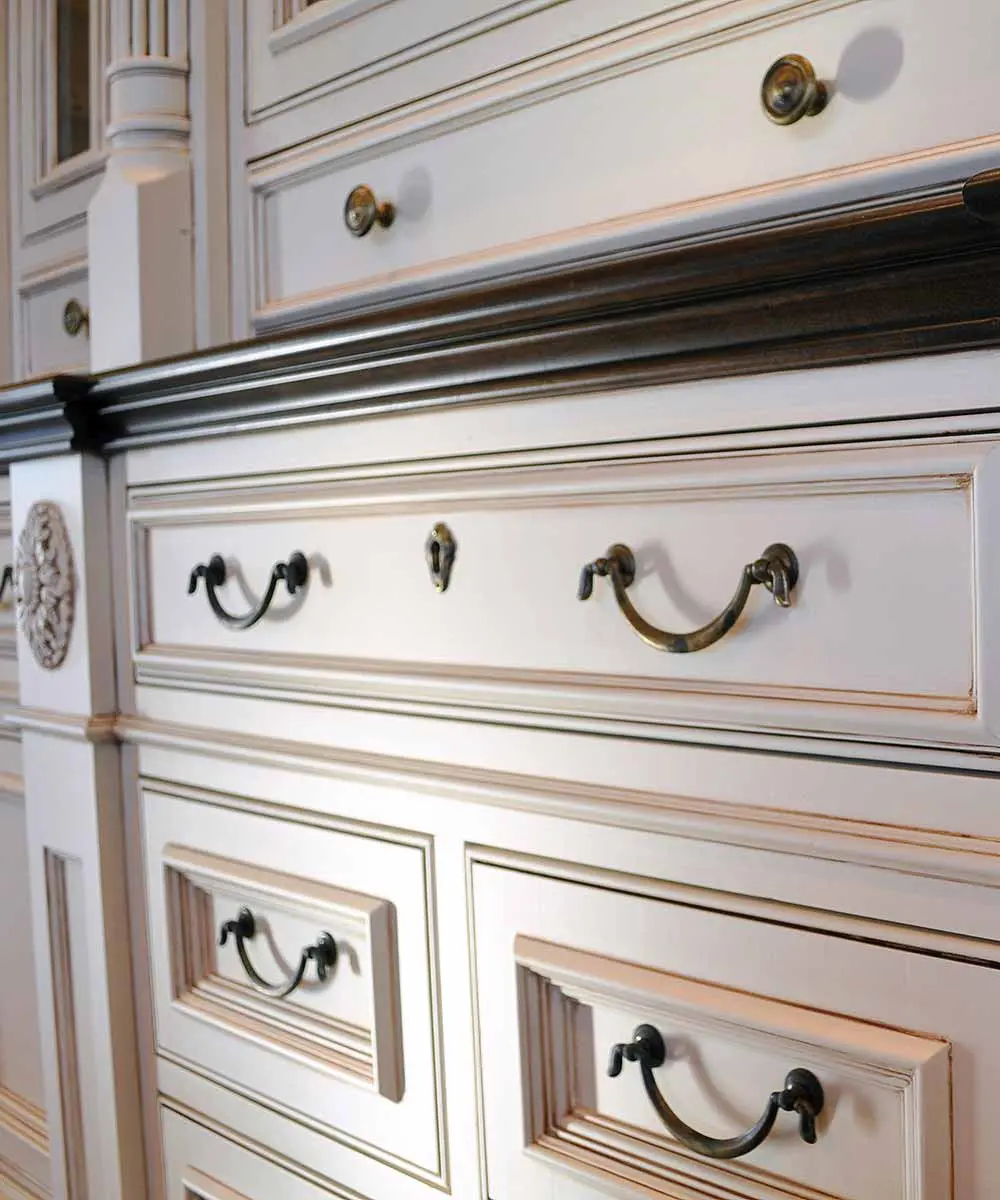 Elegant antique white dresser with drawers.