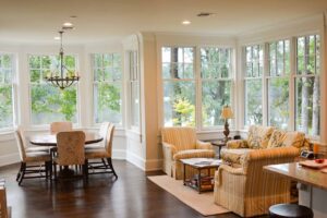 Sunlit living room with lake view.