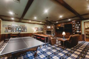 Game room with ping pong and fireplace.