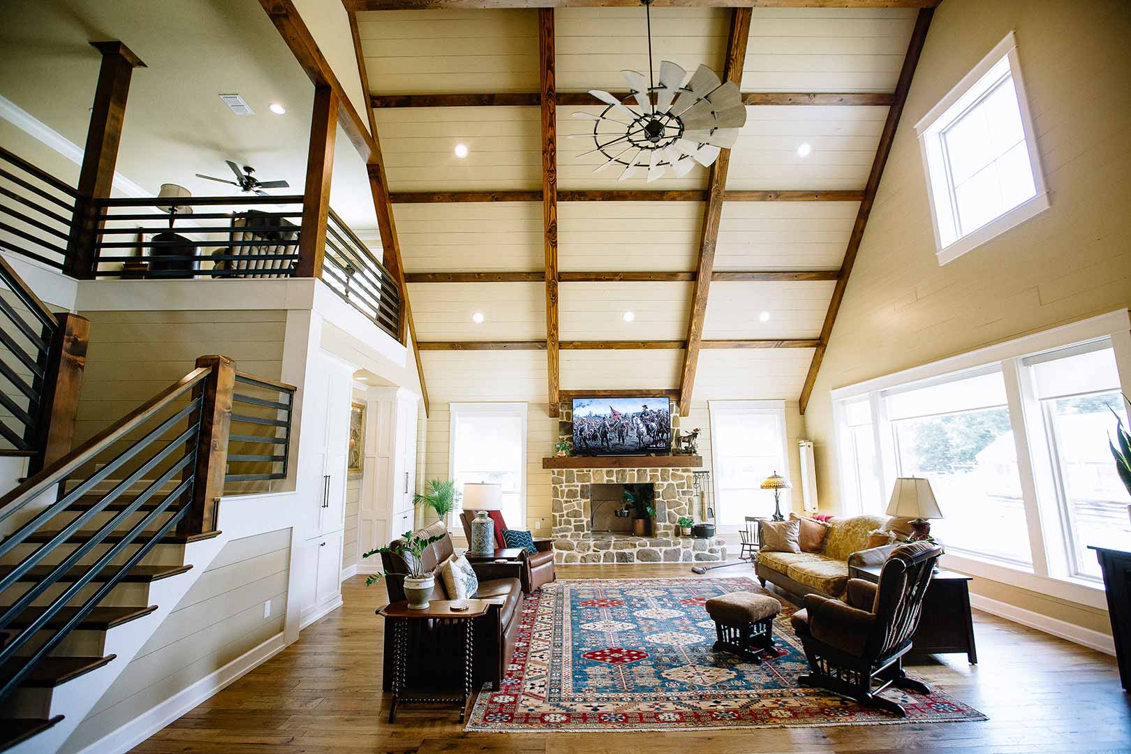 Rustic farmhouse living room with high ceiling.